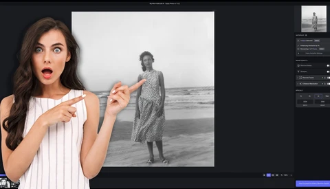 Woman in white pinstriped top gesturing toward black and white portrait of person standing in shallow ocean water.
