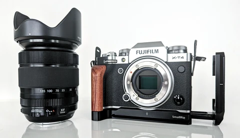 Fujifilm X-T4 mirrorless camera body with lens and SmallRig L-bracket on white background.