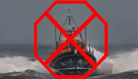 Lifeboat in rough seas with a red prohibition symbol overlaid.