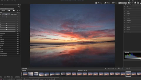 Screenshot of photo editing software displaying a vibrant sunset over calm water with warm orange and pink tones.
