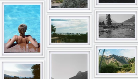 White-framed photo grid displaying landscape and portrait photography on a wall.