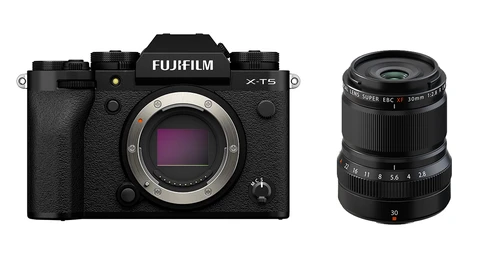 Fujifilm X-T5 mirrorless camera body next to a black manual focus lens with 30mm focal length.