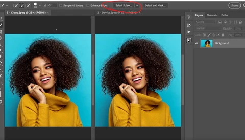 Portrait of a woman with curly hair wearing a yellow hoodie against a bright blue background.