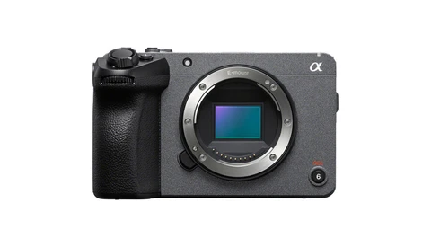 Sony Alpha mirrorless camera body with grip and exposed sensor, shot against white background.