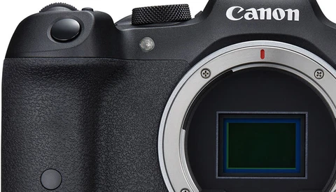 Canon mirrorless camera body with electronic viewfinder displayed front-on.