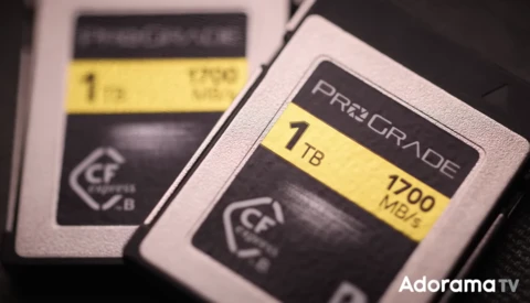Two CompactFlash memory cards with 1TB capacity labels displayed side by side.