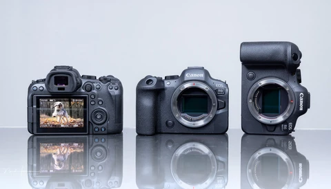 Three digital cameras displayed front and back, showing LCD screens and sensor mounts against a light background.