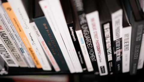 Collection of DVDs and Blu-ray cases arranged in a row, showing various film spines and titles.
