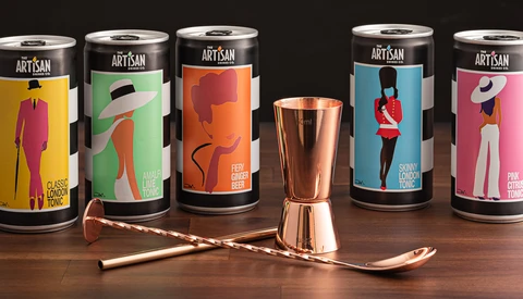 Artisan beverage packaging with colorful illustrated designs displayed with copper barware.