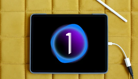 Tablet displaying a glowing blue and purple circular countdown timer showing the number 1 against a black background.