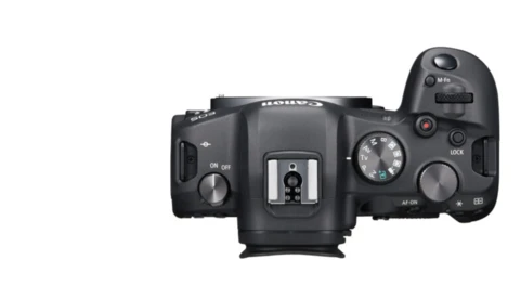 Top-down view of a mirrorless camera body with articulating screen and control dials.