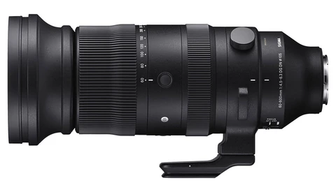 Black telephoto lens with tripod collar and focus ring against white background.