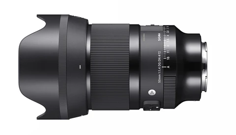 Black telephoto lens with hood and focus ring against white background.