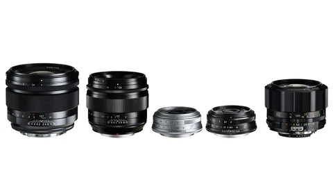Five camera lenses of varying sizes arranged in a row against a white background.