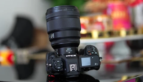 Nikon Z9 mirrorless camera with Nikon Z-mount lens mounted on top.