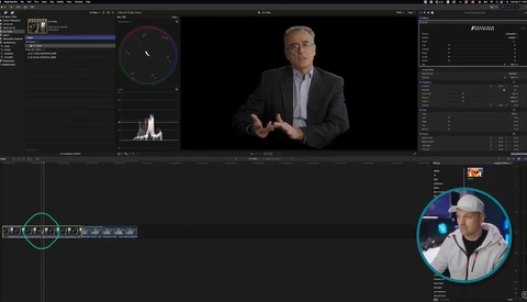 Screenshot of video editing software with color grading interface, waveform monitor, and video preview of man in business casual attire.
