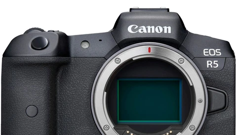 Canon EOS R5 mirrorless camera body shown from front with sensor visible through open mount.
