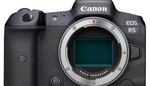 Canon EOS R5 mirrorless camera body shown from front, displaying the sensor and mount without a lens attached.