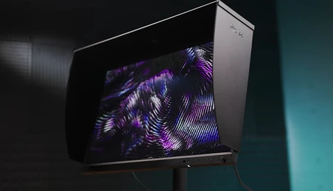 Retro television displaying abstract purple and blue geometric patterns on its screen.
