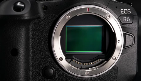 Canon EOS R6 mirrorless camera body with mount open, showing the sensor and contact pins.