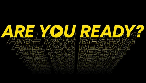 Graphic design with yellow text reading "ARE YOU READY?" layered with repeated text in gold outline below on black background.