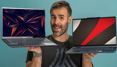 Man holding two open laptops displaying different geometric abstract wallpapers against a blue background.