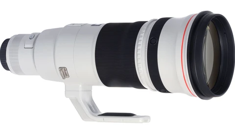 White telephoto lens with black focus ring and red AF/MF switch mounted on white support collar.