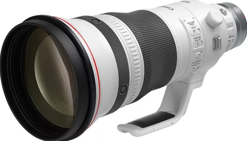 White telephoto zoom lens with large front element and integrated tripod collar.