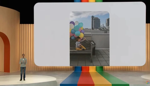 Illustration of a creative studio presentation displaying a rooftop photograph on a large screen.