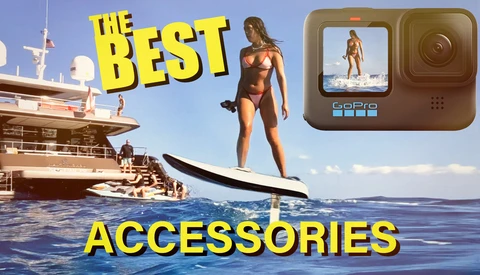 Woman on paddleboard next to luxury yacht with GoPro camera and yellow text overlay reading 'The Best Accessories.'
