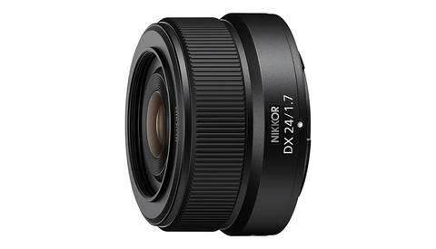Nikon DX 24mm f/1.7 prime lens with ribbed focus ring and black finish.