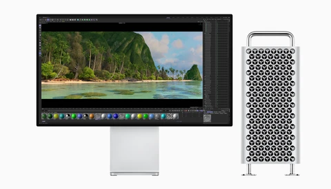 Mac Pro tower next to studio display showing tropical landscape in editing software.