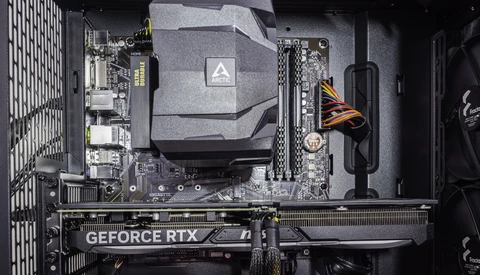 Interior view of a computer case showing motherboard, GPU, and CPU cooler installation.