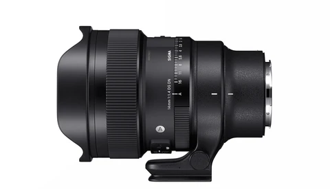 Black telephoto lens with focus ring and depth-of-field scale markings, shown in profile against white background.