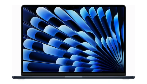 Screenshot of laptop display showing abstract blue feather or wing pattern wallpaper.