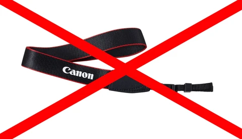 Canon camera strap with red X marks overlaid across the image.