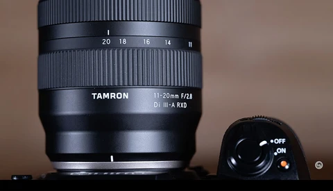 Tamron 11-20mm f/2.8 Di III-A RXD lens with focus ring and depth-of-field scale visible.