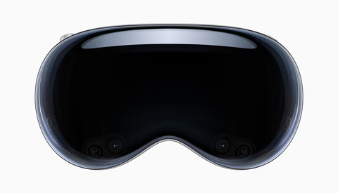 Front view of a spatial computing headset with a curved display and dark lens area.