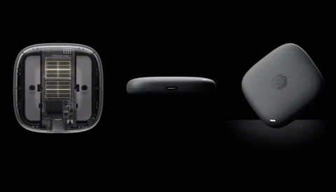 Three views of a compact wireless device showing internal components, edge profile, and curved exterior design against black background.