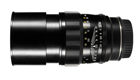 Black telephoto lens with manual focus ring and aperture scale markings.