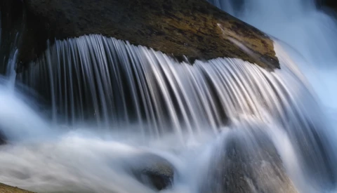 Waterfall with silky smooth water texture created using long exposure photography technique.