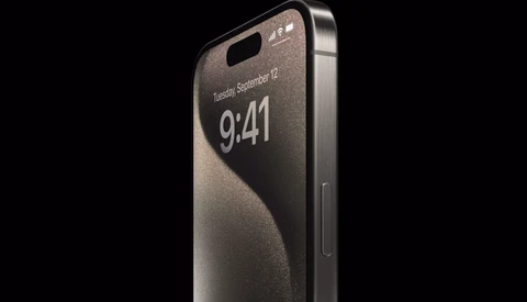 Smartphone with edge-to-edge display and minimal bezel design shown at an angle against a dark background.