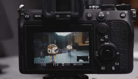 Screenshot of a mirrorless camera's rear LCD screen displaying live view with exposure settings overlay.