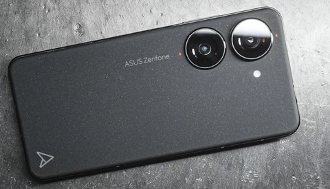 ASUS Zenfone smartphone rear showing dual camera module on dark textured background.