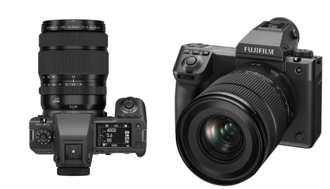Two mirrorless cameras displayed from above: a compact model with telephoto lens on the left, and a larger body with wide-angle lens on the right.
