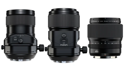 Three black telephoto lenses arranged side by side, displaying different barrel lengths and focusing mechanisms.