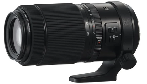 Black telephoto zoom lens with focus ring and stabilization controls visible on barrel.
