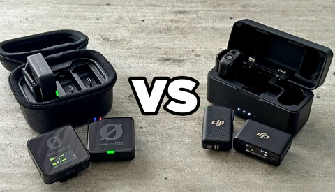 Two wireless microphone systems displayed side-by-side with their cases and batteries for comparison.