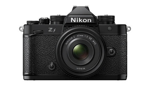 Nikon Zf mirrorless camera with 40mm f/2 SE lens mounted, shown from front against white background.