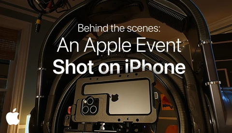 Screenshot of Apple's "Behind the scenes: An Apple Event Shot on iPhone" title card displayed on a professional film production monitor mounted inside a camera rig.